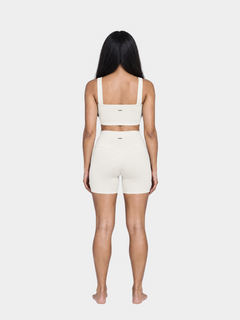 Woman wearing the Allure Short in Ivory by Gallenn – full back view