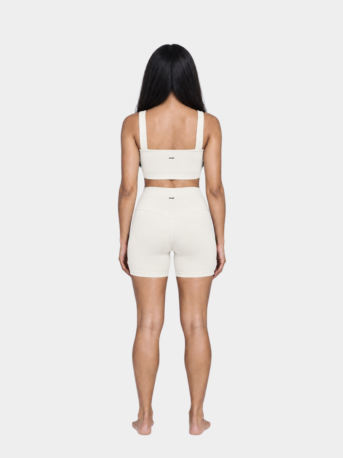 Woman wearing the Allure Short in Ivory by Gallenn – full back view