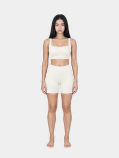 Woman wearing the Allure Short in Ivory by Gallenn – full front view