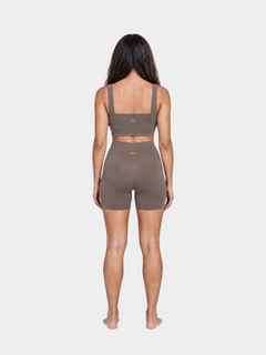 Woman wearing the Allure Short in Mocha by Gallenn – full back view