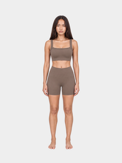 Woman wearing the Allure Short in Mocha by Gallenn – full front view