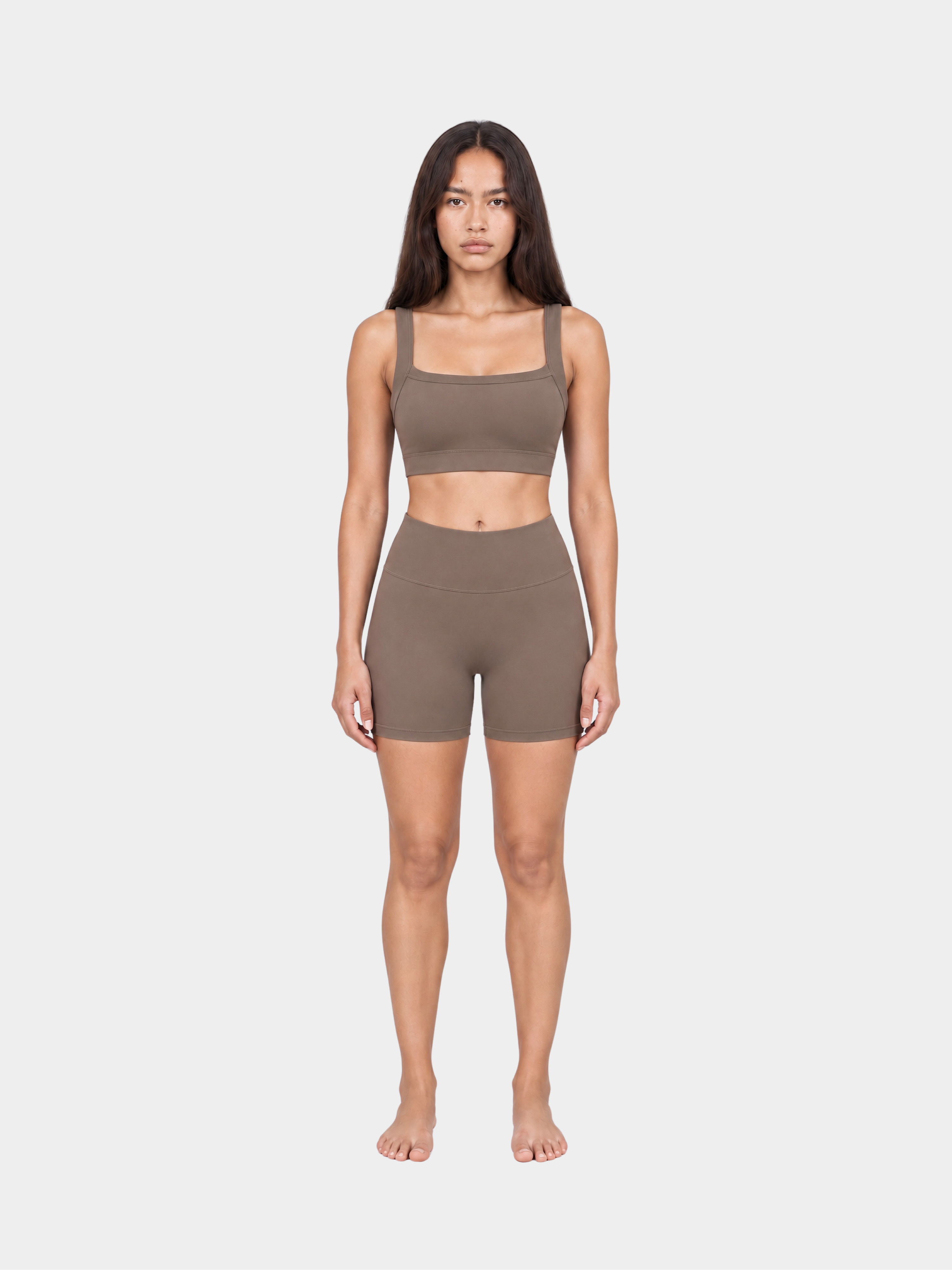 Woman wearing the Allure Short in Mocha by Gallenn – full front view