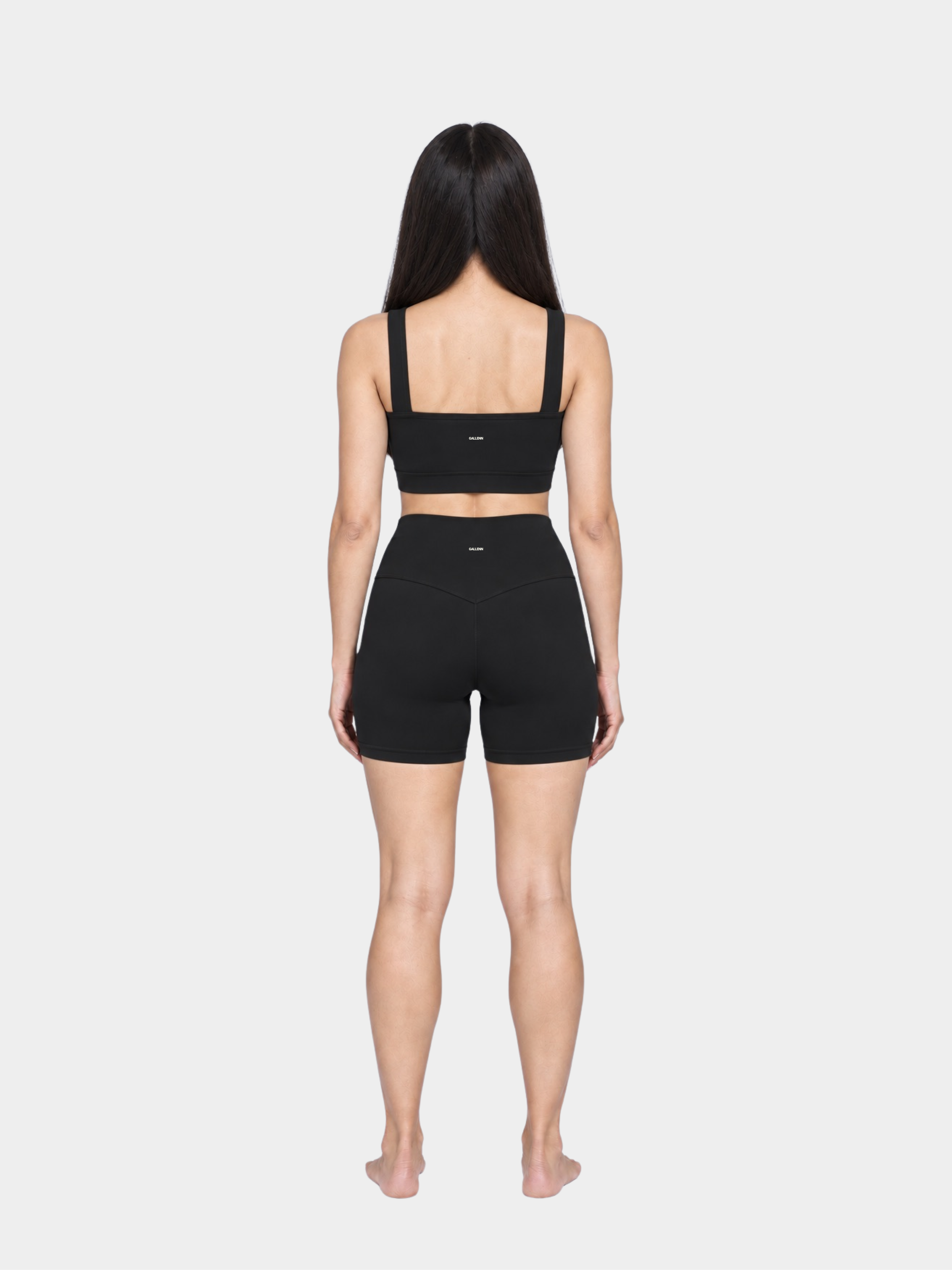 Woman wearing the Allure Short in Black by Gallenn – full back view