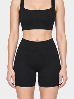 Woman wearing the Allure Short in Black by Gallenn – front detail