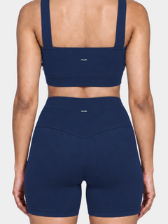 Woman wearing the Allure Short in Navy Blue by Gallenn – back detail