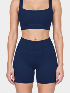 Woman wearing the Allure Short in Navy Blue by Gallenn – front detail