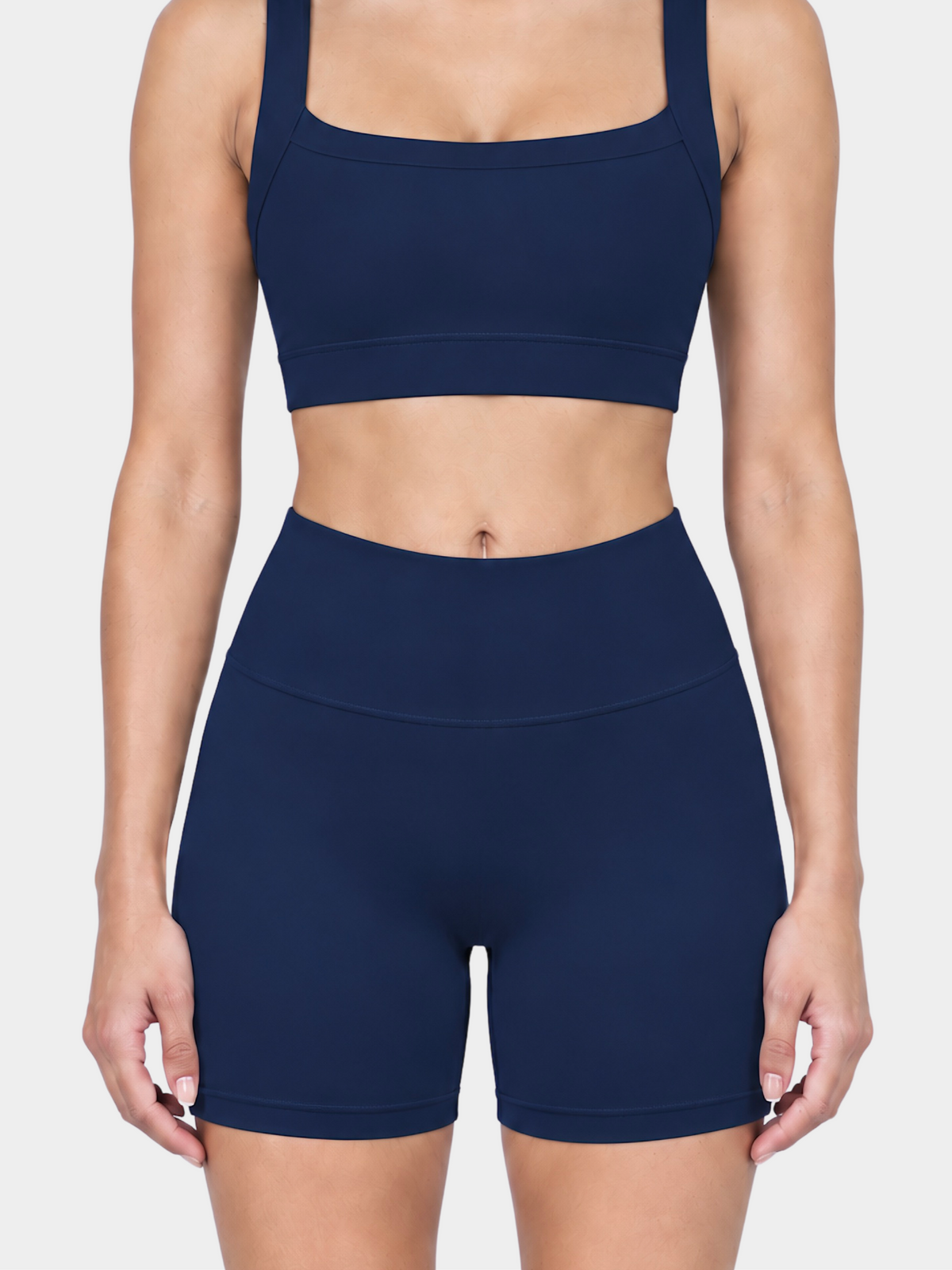 Woman wearing the Allure Short in Navy Blue by Gallenn – front detail