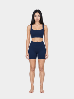Woman wearing the Allure Short in Navy Blue by Gallenn – full front view