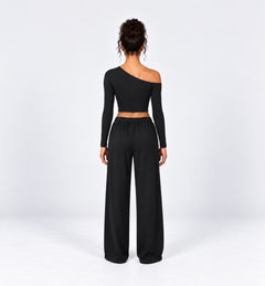 Woman wearing the Colette Top in Black with matching Colette Pants by Gallenn – back view