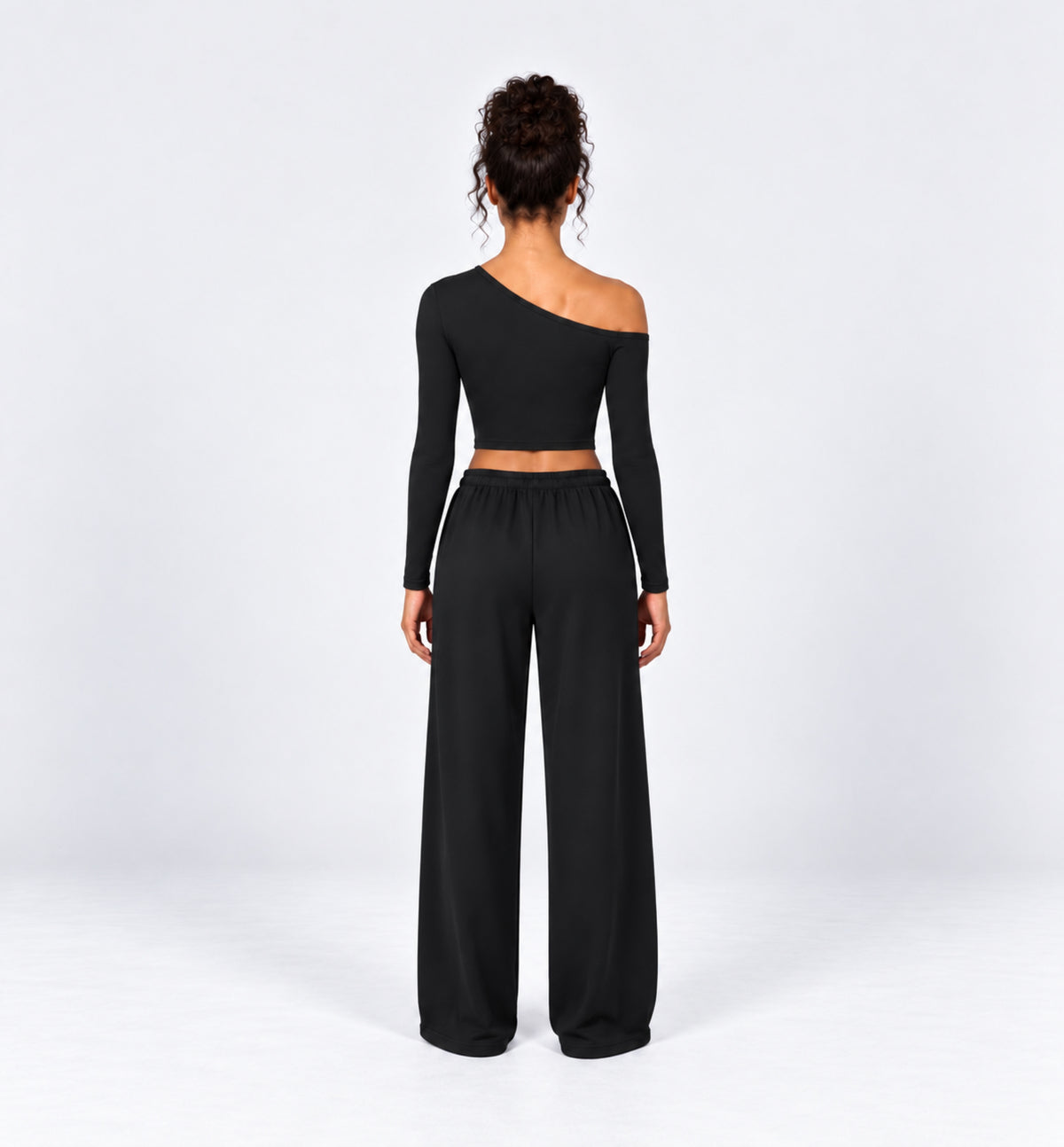 Woman wearing the Colette Top in Black with matching Colette Pants by Gallenn – back view