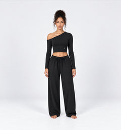 Woman wearing the Colette Top in Black with matching Colette Pants by Gallenn – front view