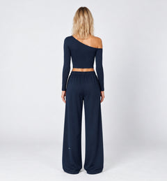 Woman wearing the Colette Top in Navy Blue with matching Colette Pants by Gallenn – back view