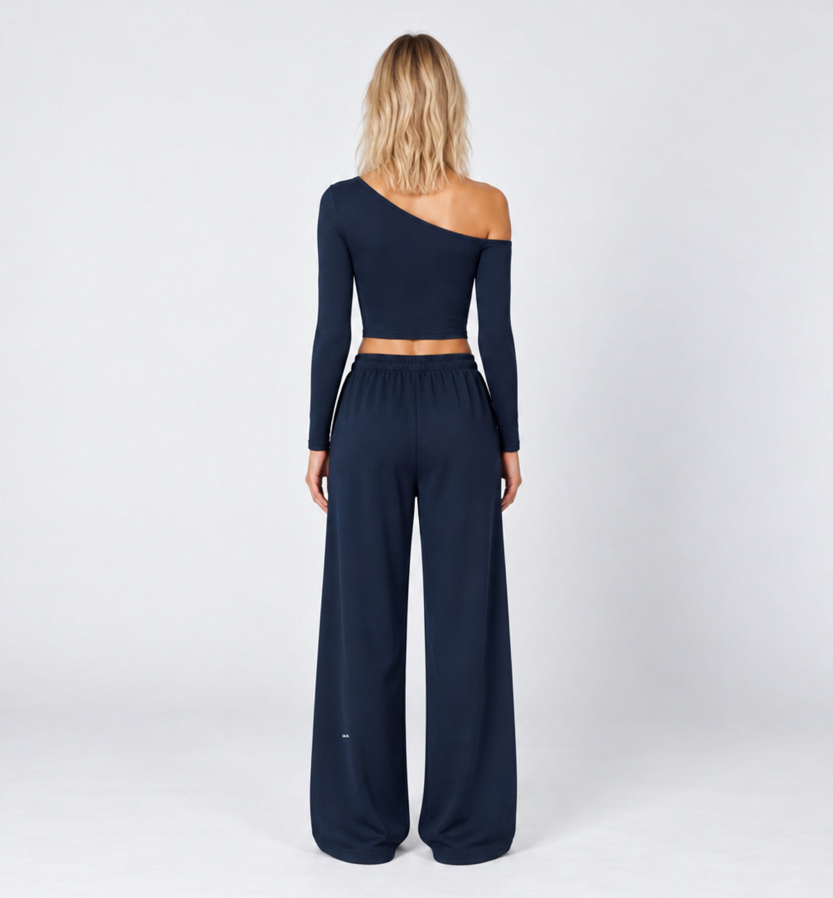 Woman wearing the Colette Top in Navy Blue with matching Colette Pants by Gallenn – back view