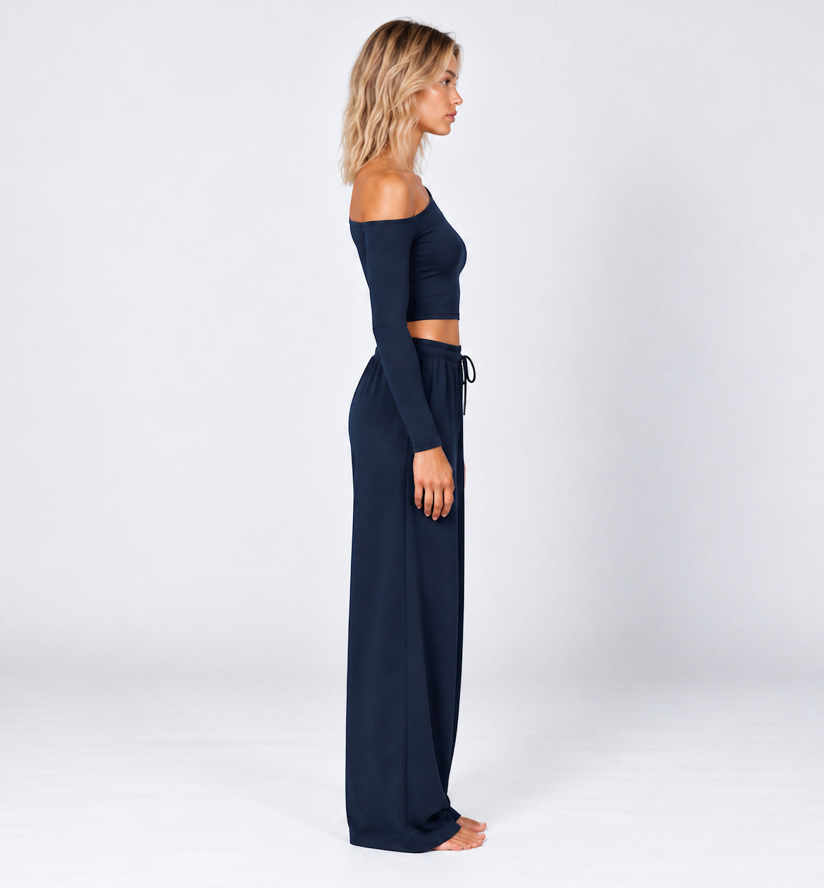 Woman wearing the Colette Top in Navy Blue with matching Colette Pants by Gallenn – side view