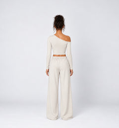 Woman wearing Colette Pants in Vanilla with the matching Colette Top by Gallenn – back view
