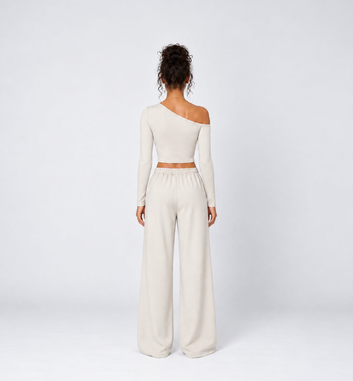 Woman wearing Colette Pants in Vanilla with the matching Colette Top by Gallenn – back view