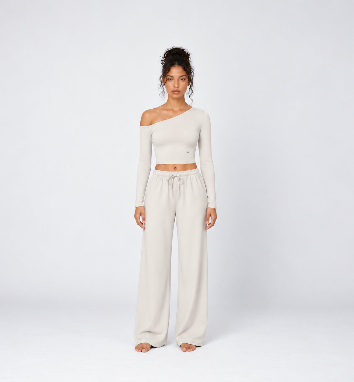 Woman wearing Colette Pants in Vanilla with the matching Colette Top by Gallenn – front view