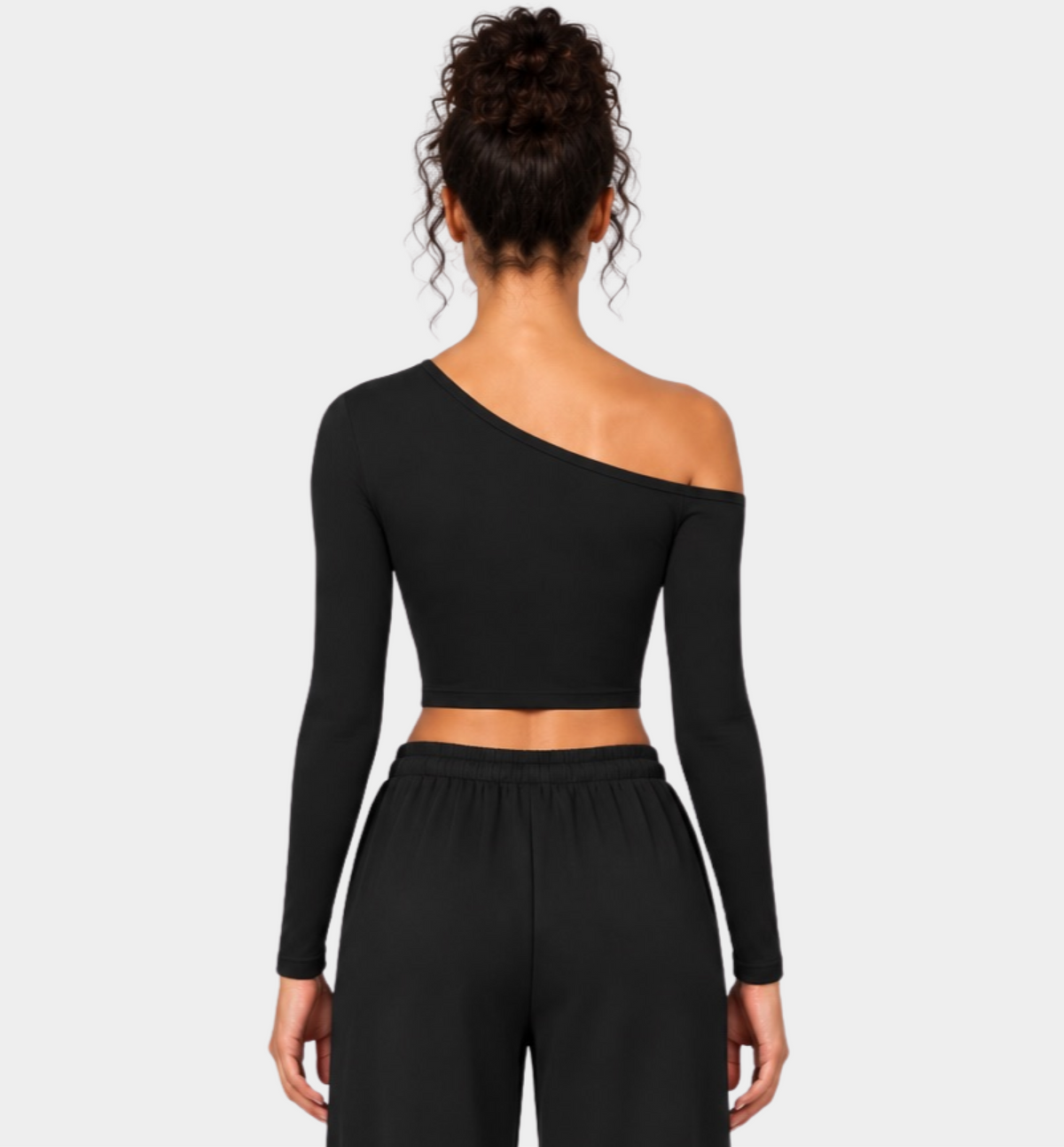 Woman wearing the Colette Top in Black with matching Colette Pants by Gallenn – back view