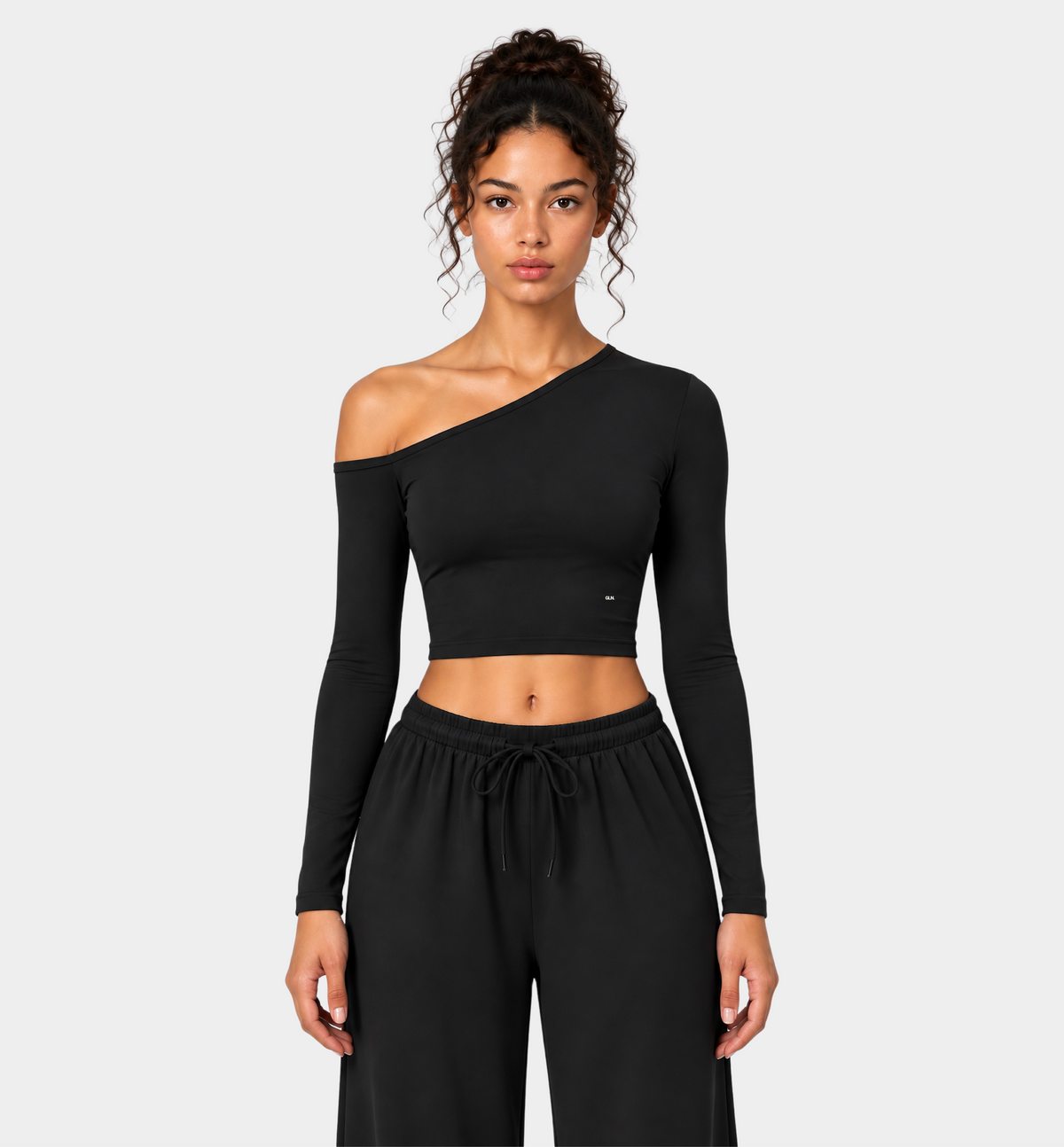 Woman wearing the Colette Top in Black with matching Colette Pants by Gallenn – front view