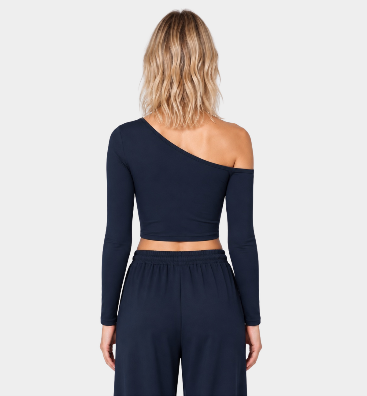 Woman wearing the Colette Top in Navy Blue with matching Colette Pants by Gallenn – back view