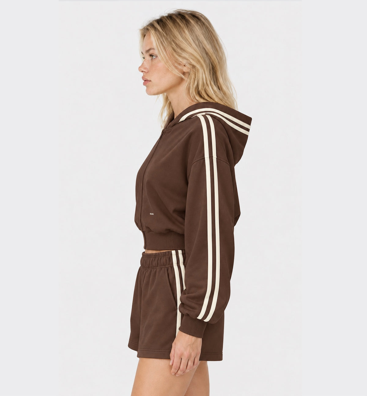 The Weekender Zip-Up Hoodie in Coffee by Gallenn – model side with cream contrast stripes