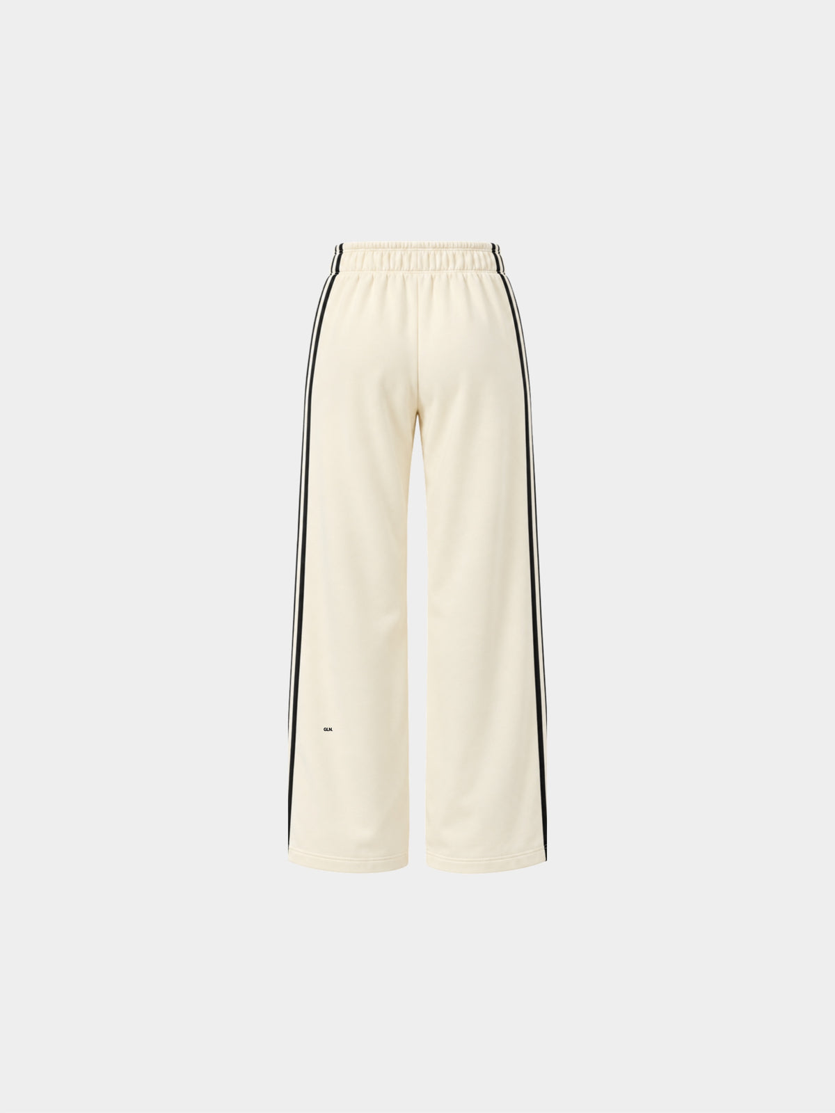 The Weekender Pants in Beige by Gallenn – product back view with wide legs and black side stripes