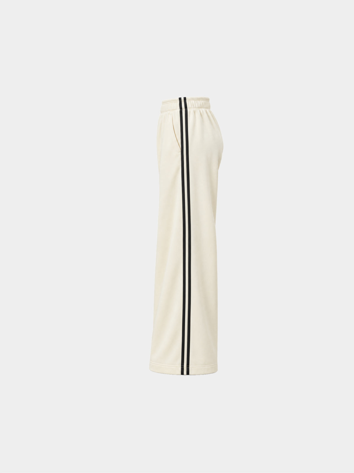 The Weekender Pants in Beige by Gallenn – product side view with wide legs and black side stripes
