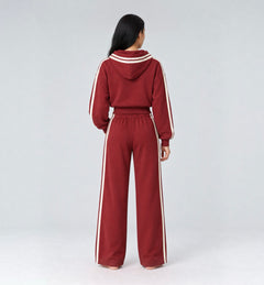 The Weekender Pants in Burgundy by Gallenn – model back view with wide legs and cream side stripes, worn with the matching hoodie