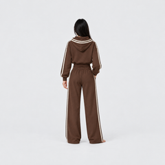 The Weekender Pants in Coffee by Gallenn – model back view, wide legs and cream side stripes, worn with the matching hoodie