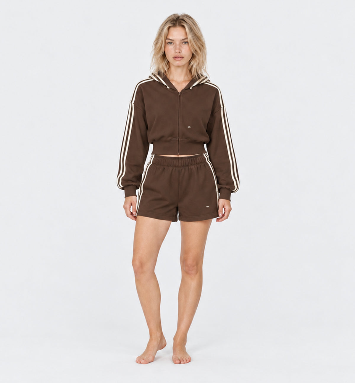 The Weekender Shorts in Coffee by Gallenn – model front with cream side stripes