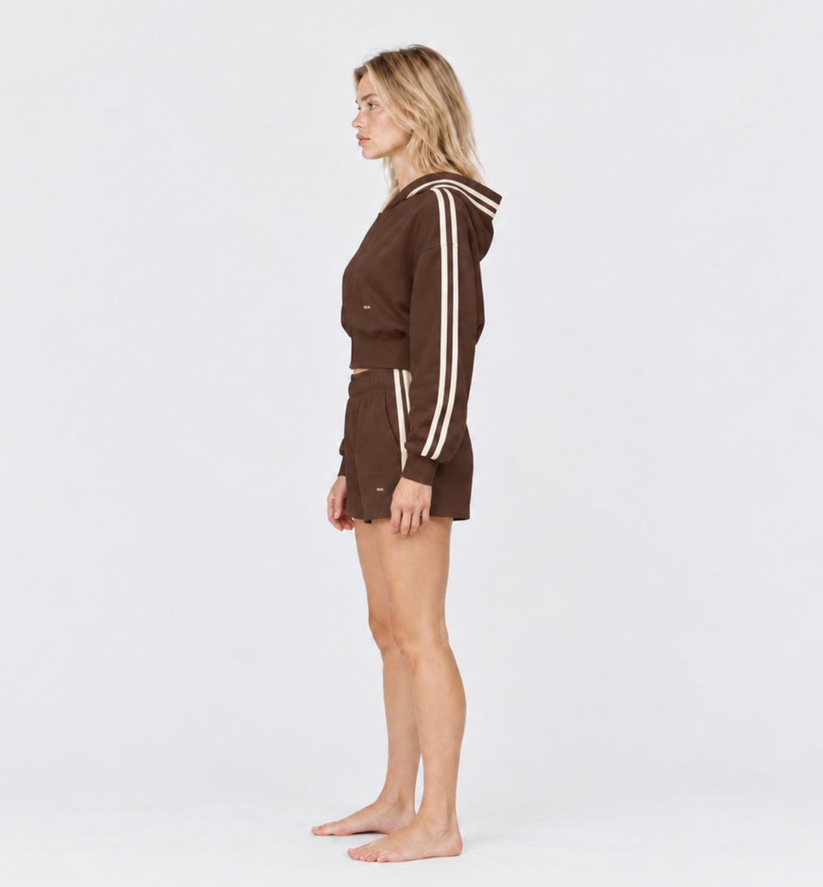 The Weekender Shorts in Coffee by Gallenn – model side with cream side stripes